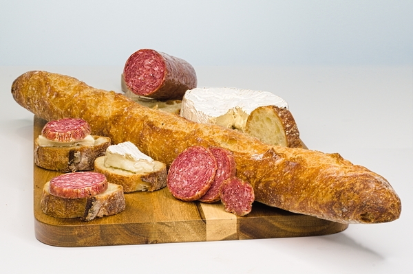 Charcuterie featuring salami and brie