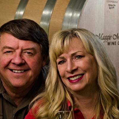 Mark and Maggie Malick in front of a barrel