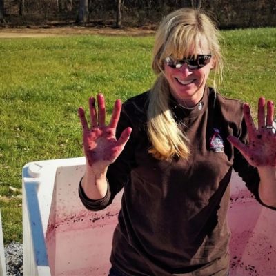 Maggie Malick crushing grapes