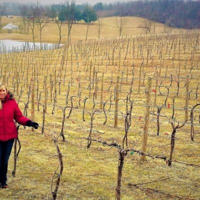 Maggie Malick in vineyard during winter